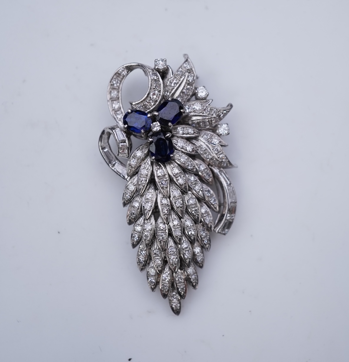 A sapphire and diamond brooch, mid 20th century